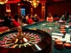 Engage in thrilling online betting with Amanahtoto, featuring an exciting casino setup with roulette and poker games.
