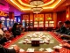 Engaging players at a Mahjong table with PG Soft slot machines in a vibrant casino atmosphere.